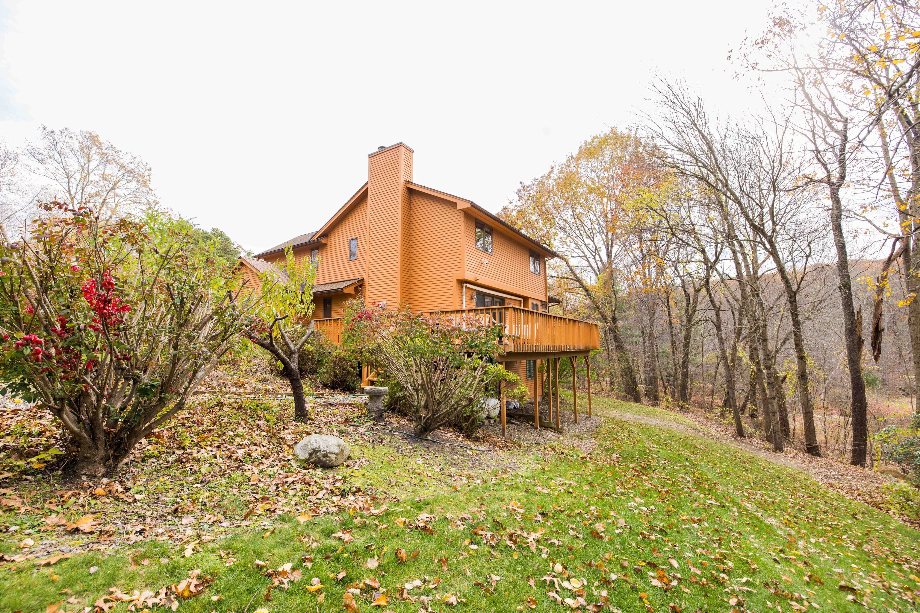 18 Clifford Avenue Tolland, CT 06084 - Photo 37 of 40 a backyard of a house with table and chairs