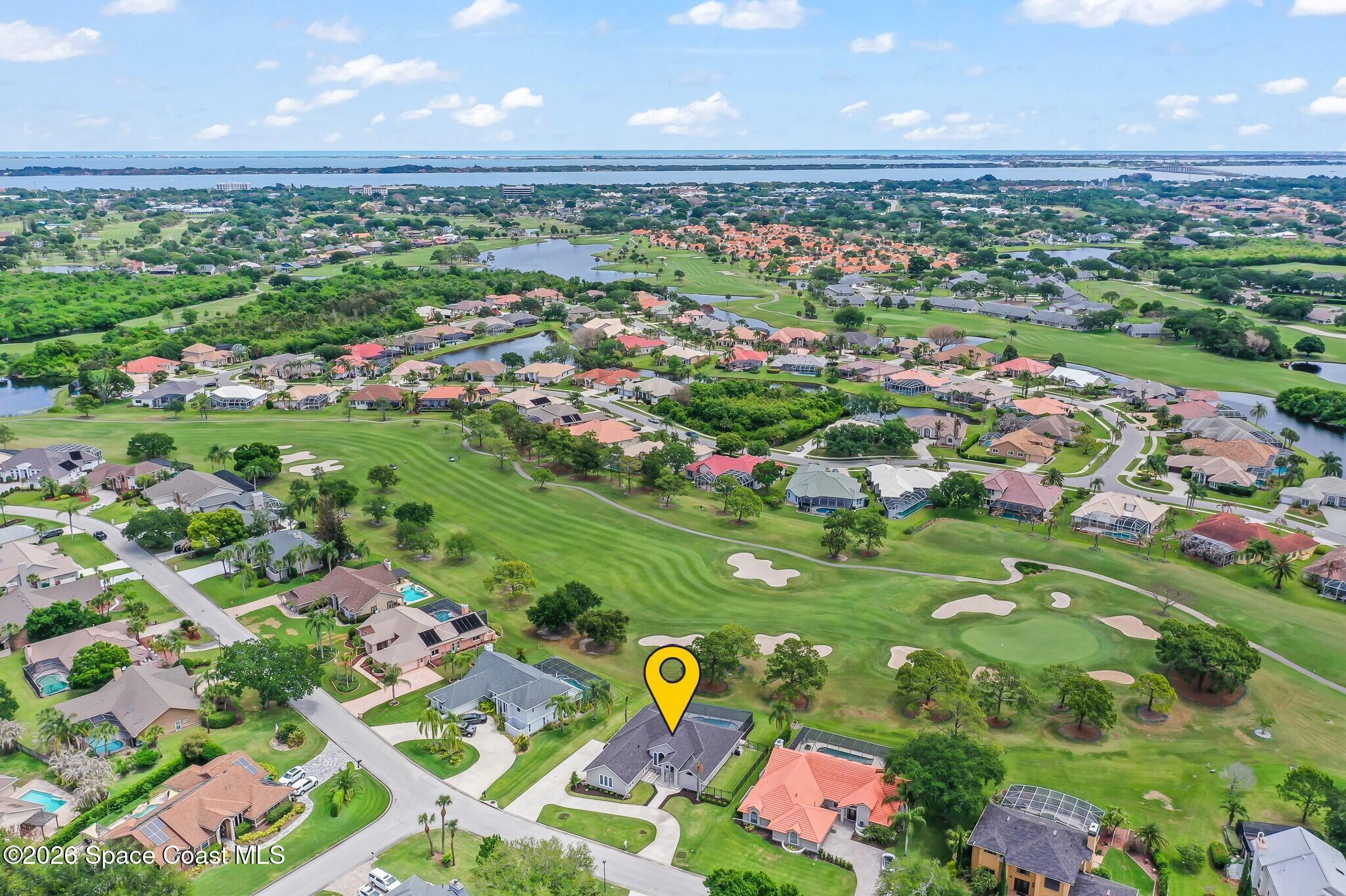 697 Spring Lake Drive Melbourne, FL 32940 - Photo 37 of 45 an aerial view of residential houses with outdoor space