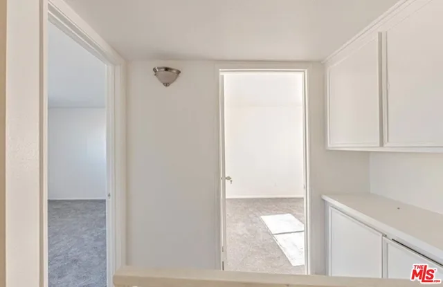 a view of walk in closet with window