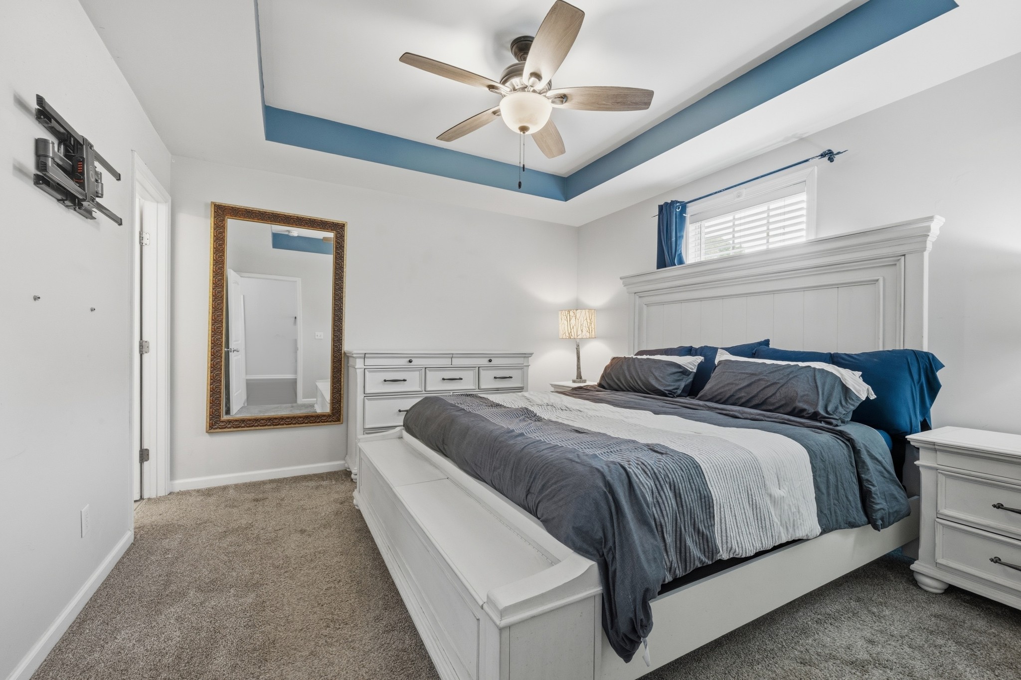 504 Daugherty Lane Burns, TN 37029 - Photo 20 of 30 a spacious bedroom with a bed and a ceiling fan