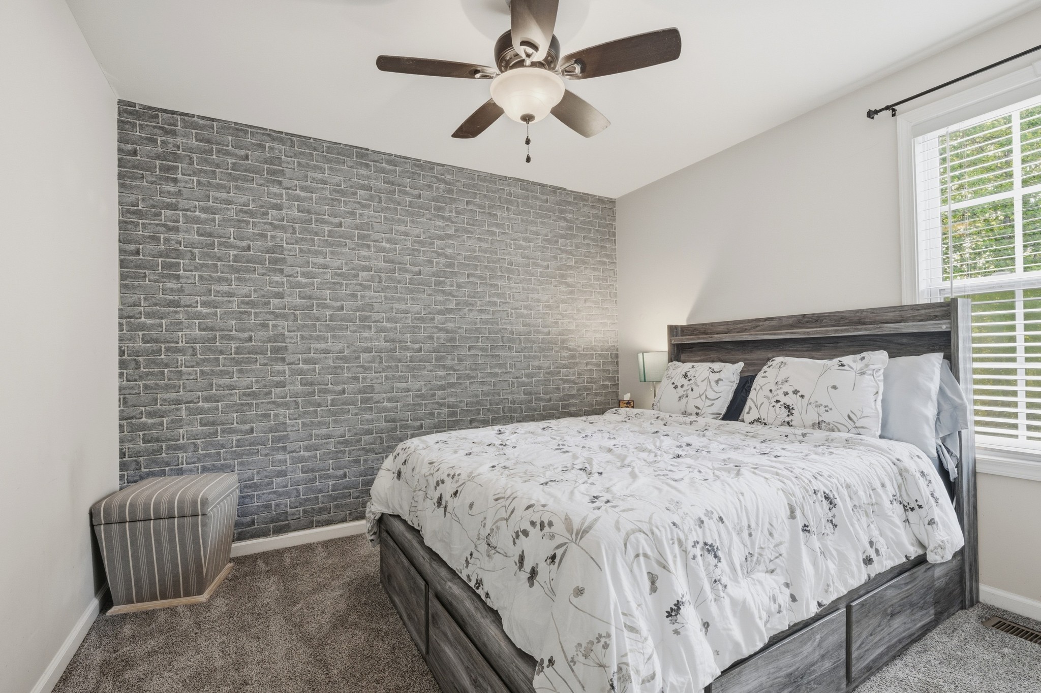 504 Daugherty Lane Burns, TN 37029 - Photo 25 of 30 a bedroom with a bed and a chair