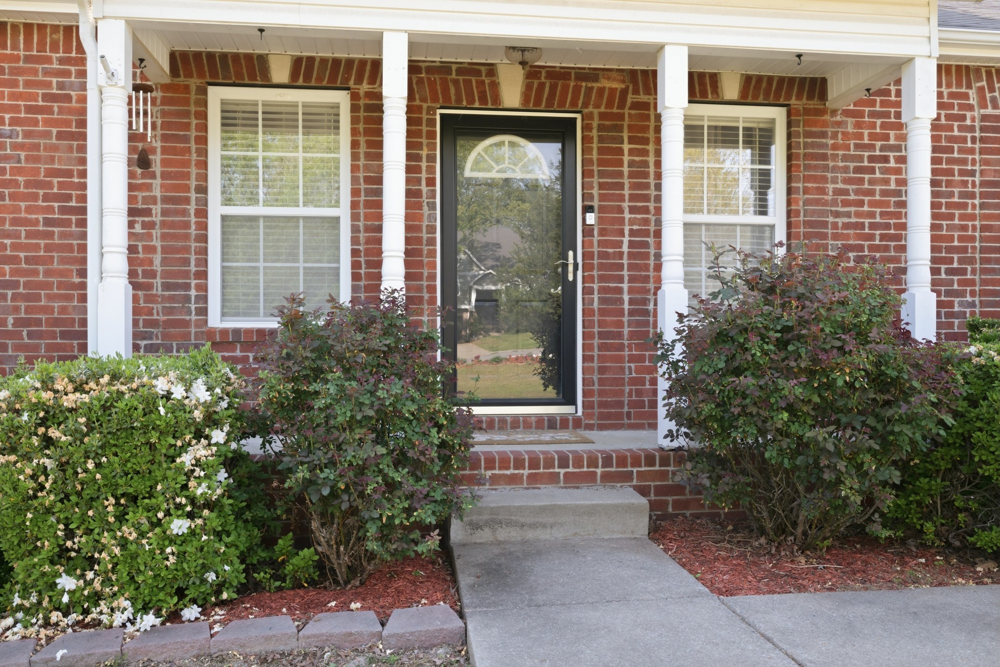504 Daugherty Lane Burns, TN 37029 - Photo 6 of 30 a front view of a brick house with a yard