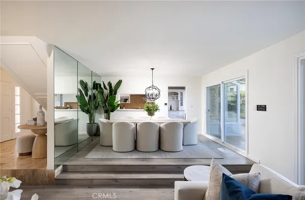 a view of living room with furniture and potted plant