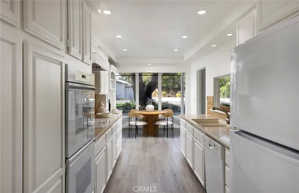 a kitchen with counter top space and stainless steel appliances