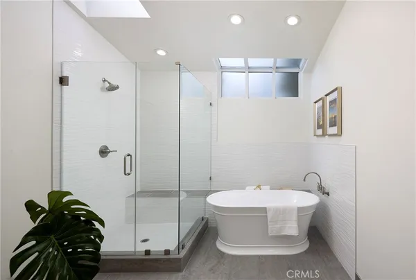 a bathroom with a bathtub and shower