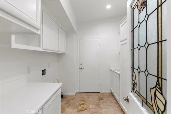 a view of a storage & utility room with a sink