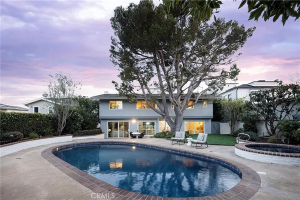 a view of house with outdoor space and trees