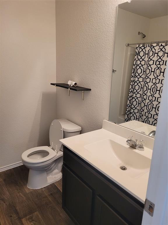 14917 Gypsum Mill Road Manor, TX 78653 - Photo 22 of 28 Functional bathroom features a clean vanity and ample space, offering convenience and practical design.
