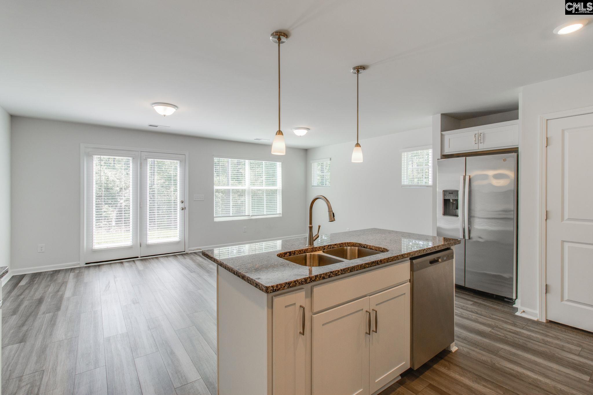312 Reedmace Court Lexington, SC 29072 - Photo 12 of 29 a kitchen that has a sink a counter space and stainless steel appliances