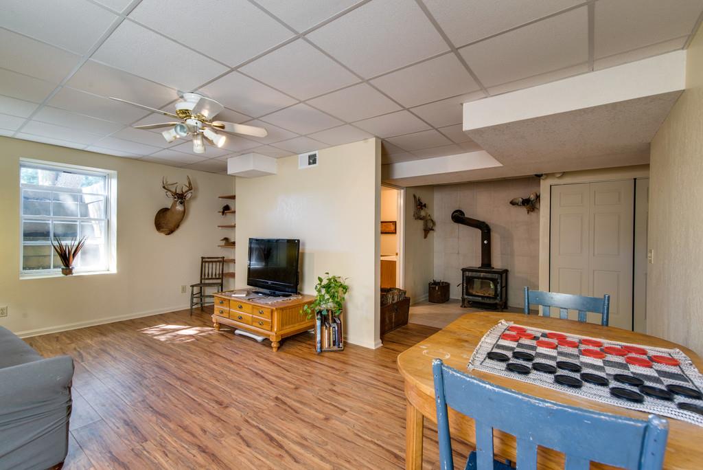 7315 Coldwater Road Fairview, TN 37062 - Photo 20 of 30 a living room with furniture flat screen tv and a fireplace