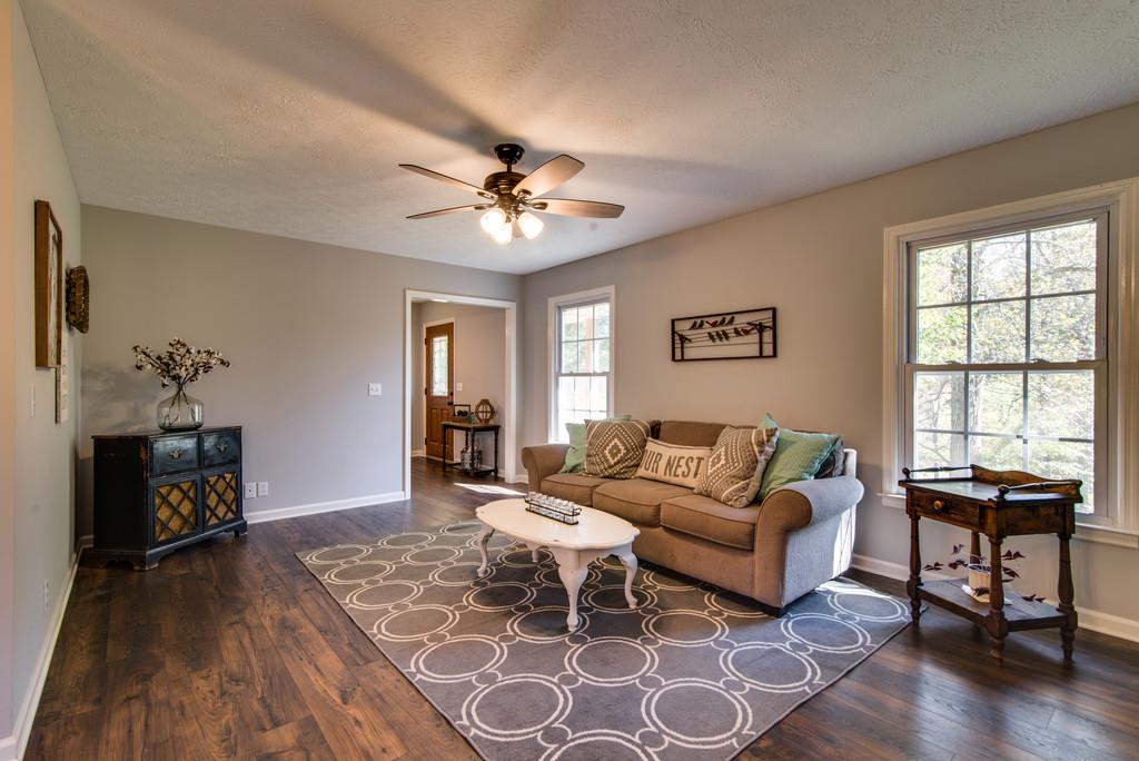 7315 Coldwater Road Fairview, TN 37062 - Photo 5 of 30 a living room with furniture a wooden floor and a window