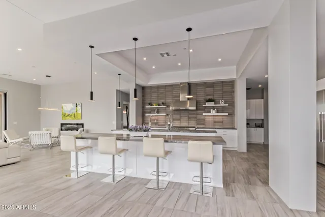a kitchen with granite countertop stainless steel appliances and cabinets