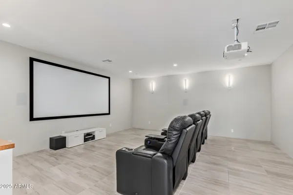 a view of a patio with table and chairs floor to ceiling window with yard