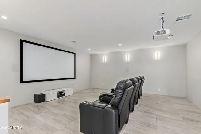 a view of a patio with table and chairs floor to ceiling window with yard