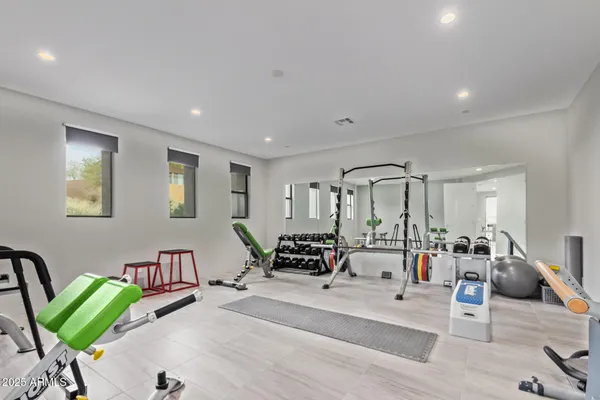 a view of a patio with swimming pool table and chairs