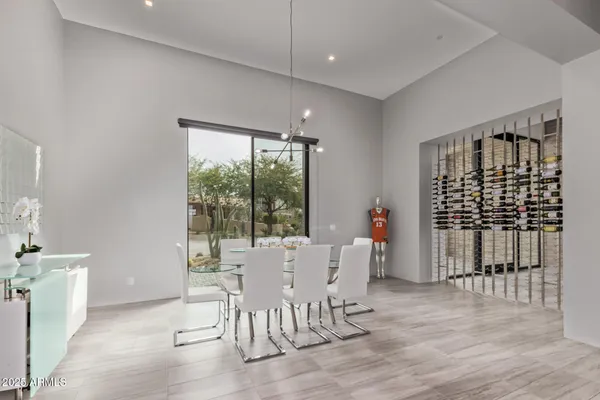 a living room with couch and a floor to ceiling window