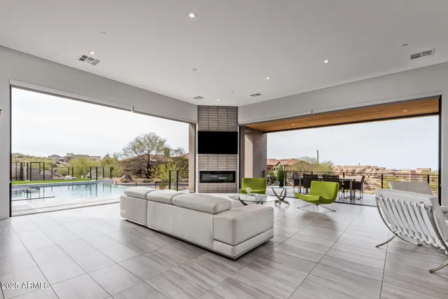 a living room with fireplace furniture and a flat screen tv