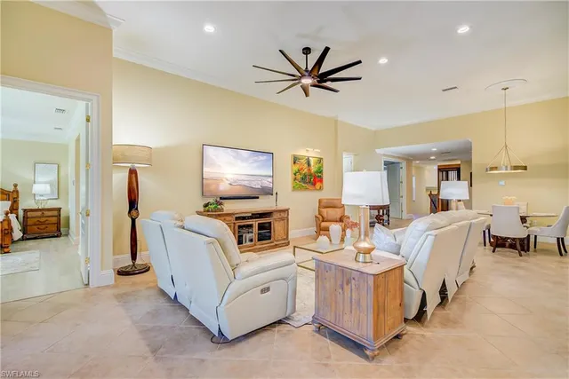 a large kitchen with a table and chairs