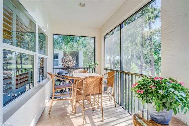 a dining room with furniture window and natural light
