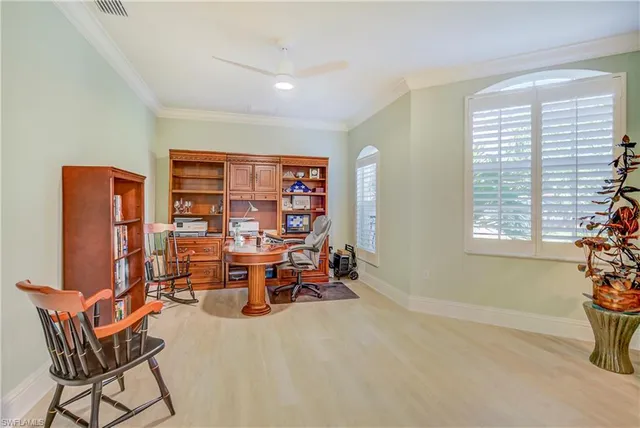 a reading room with furniture and a window