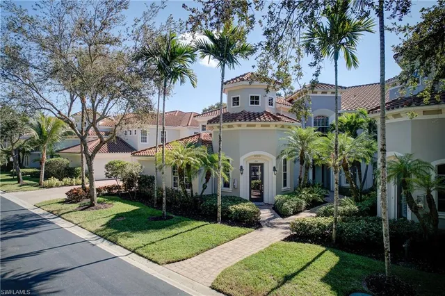an aerial view of house with yard swimming pool and outdoor seating