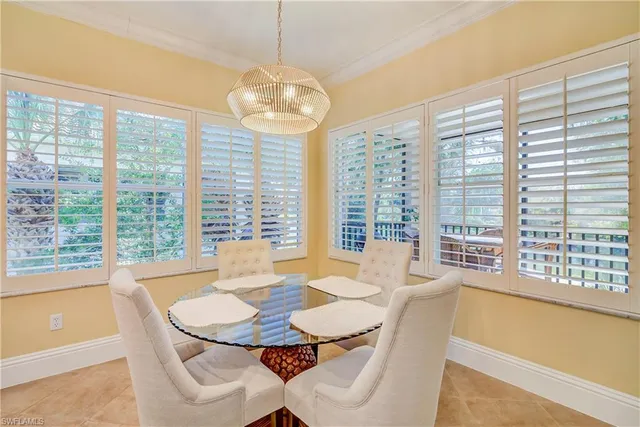 a kitchen with granite countertop a sink a stove and cabinets
