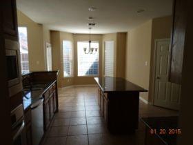 3104 Angus Drive Plano, TX 75025 - Photo 12 of 35 a kitchen with a sink and a refrigerator