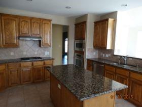 3104 Angus Drive Plano, TX 75025 - Photo 13 of 35 a kitchen with stainless steel appliances granite countertop a sink a stove counter space and cabinets
