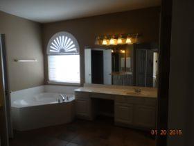 3104 Angus Drive Plano, TX 75025 - Photo 19 of 35 a bathroom with a sink and a mirror