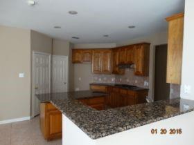 3104 Angus Drive Plano, TX 75025 - Photo 10 of 35 a kitchen with a sink a stove and cabinets