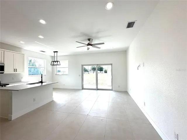 a view of a kitchen with a sink and microwave