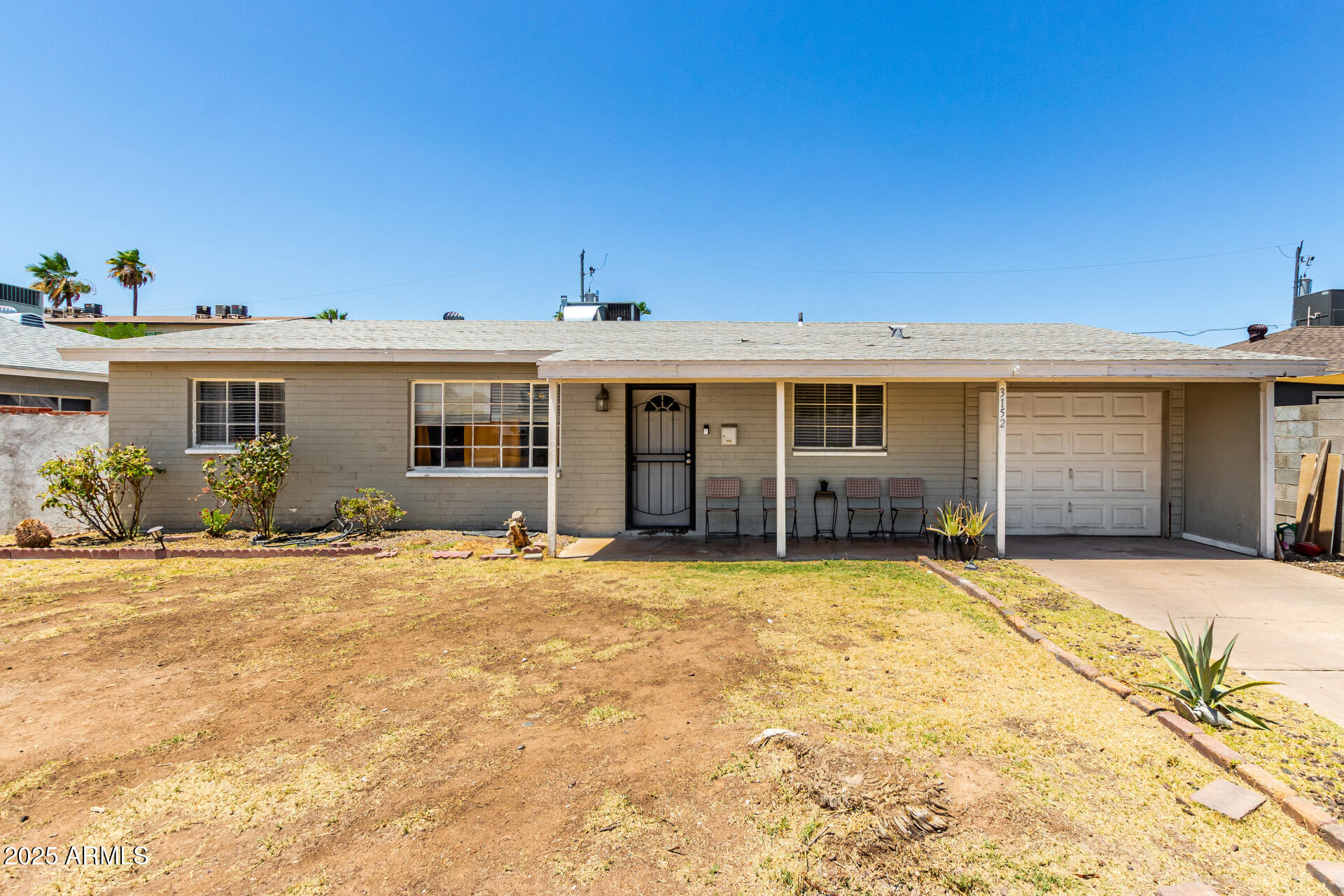3152 North 24th Drive Phoenix, AZ 85015 - Photo 1 of 28 a house with yard in front of it