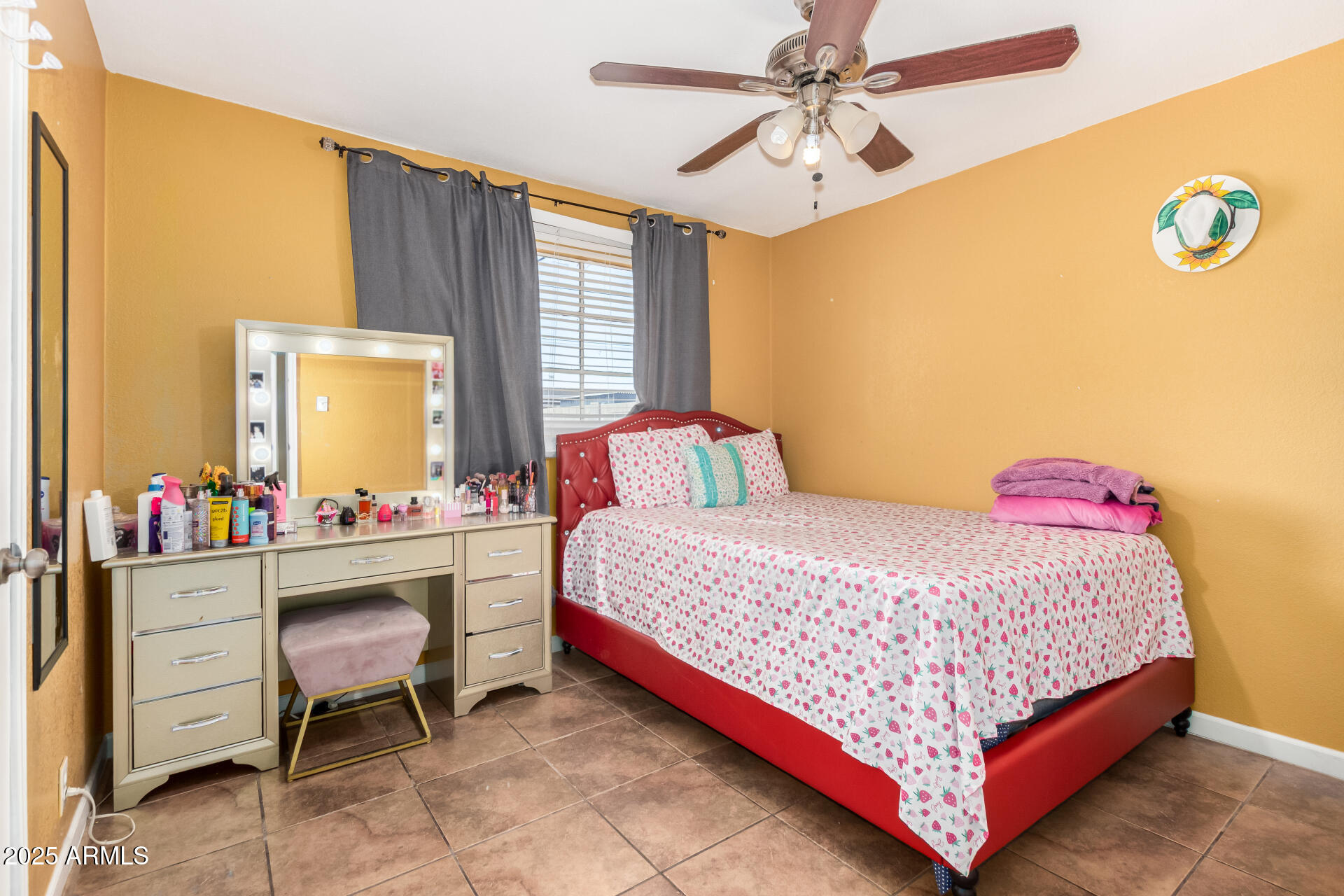 3152 North 24th Drive Phoenix, AZ 85015 - Photo 20 of 28 a bedroom with a bed and a chandelier