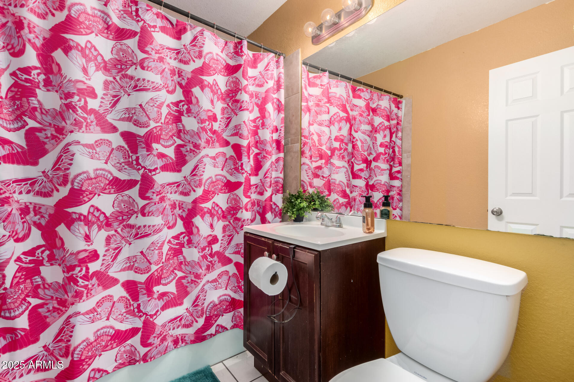 3152 North 24th Drive Phoenix, AZ 85015 - Photo 22 of 28 a bathroom with a toilet and a sink