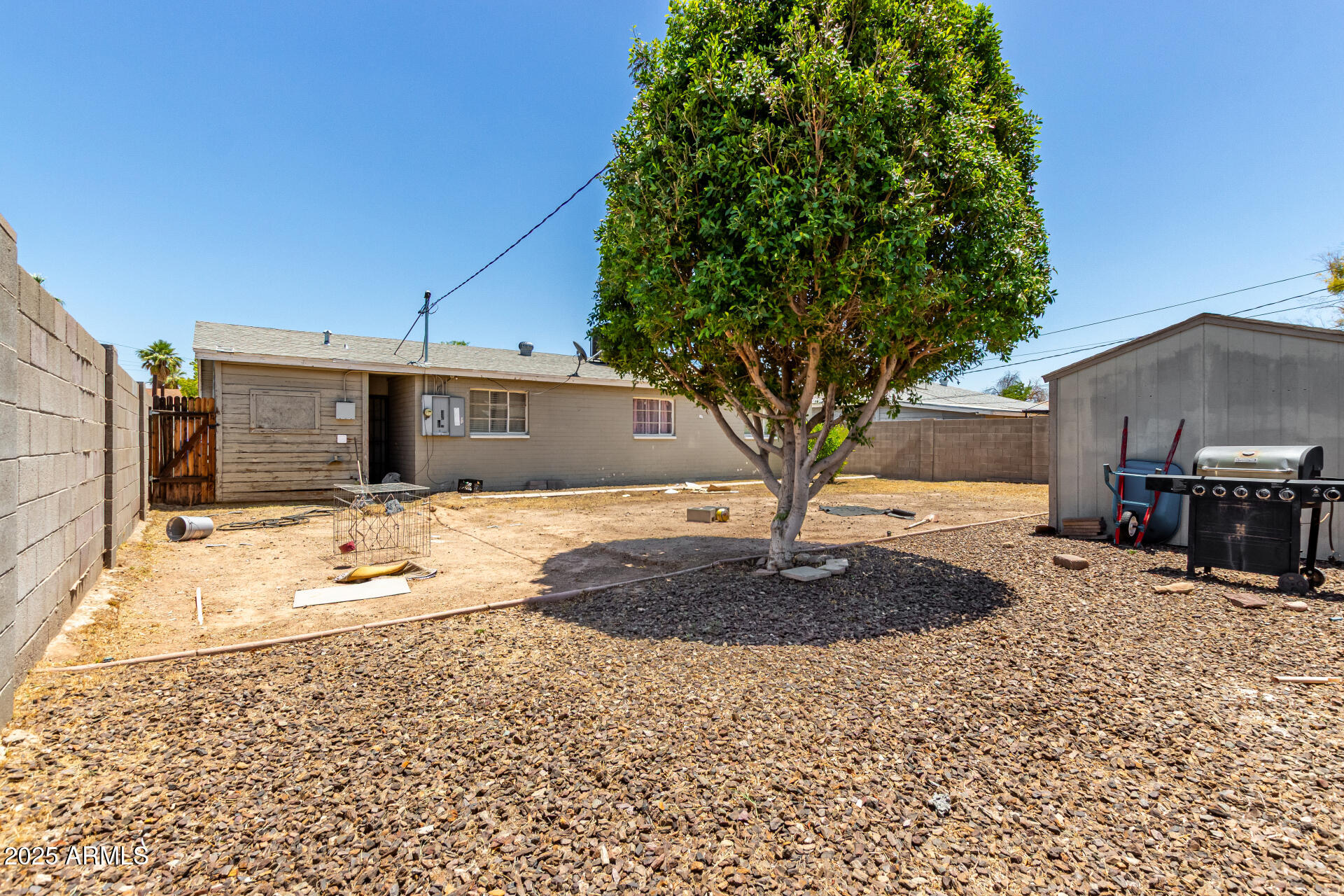 3152 North 24th Drive Phoenix, AZ 85015 - Photo 25 of 28 a front view of a house with a yard