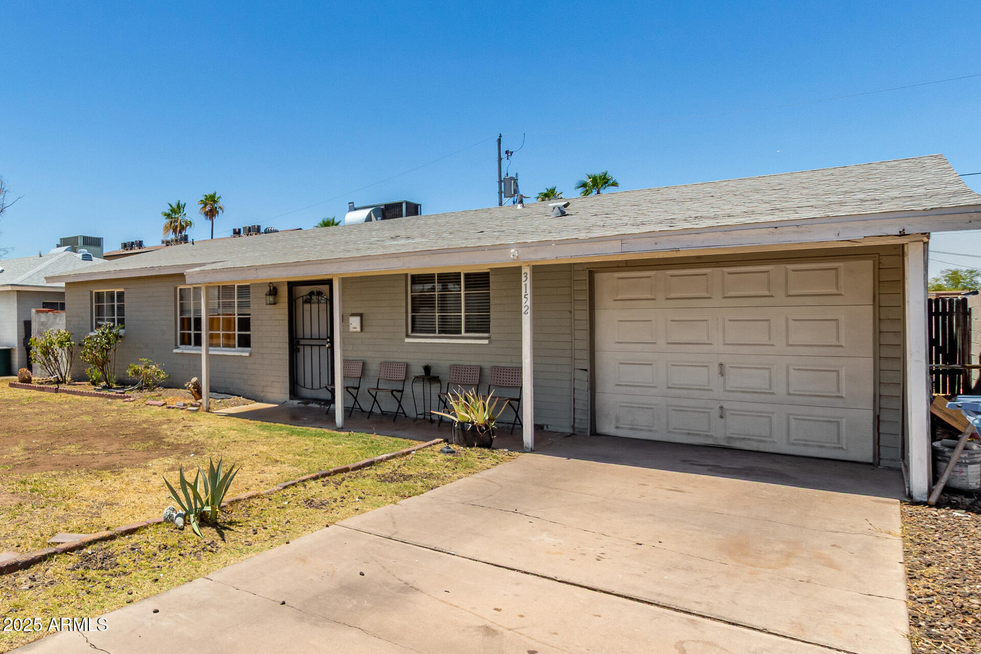 3152 North 24th Drive Phoenix, AZ 85015 - Photo 3 of 28 a view of a house with a yard