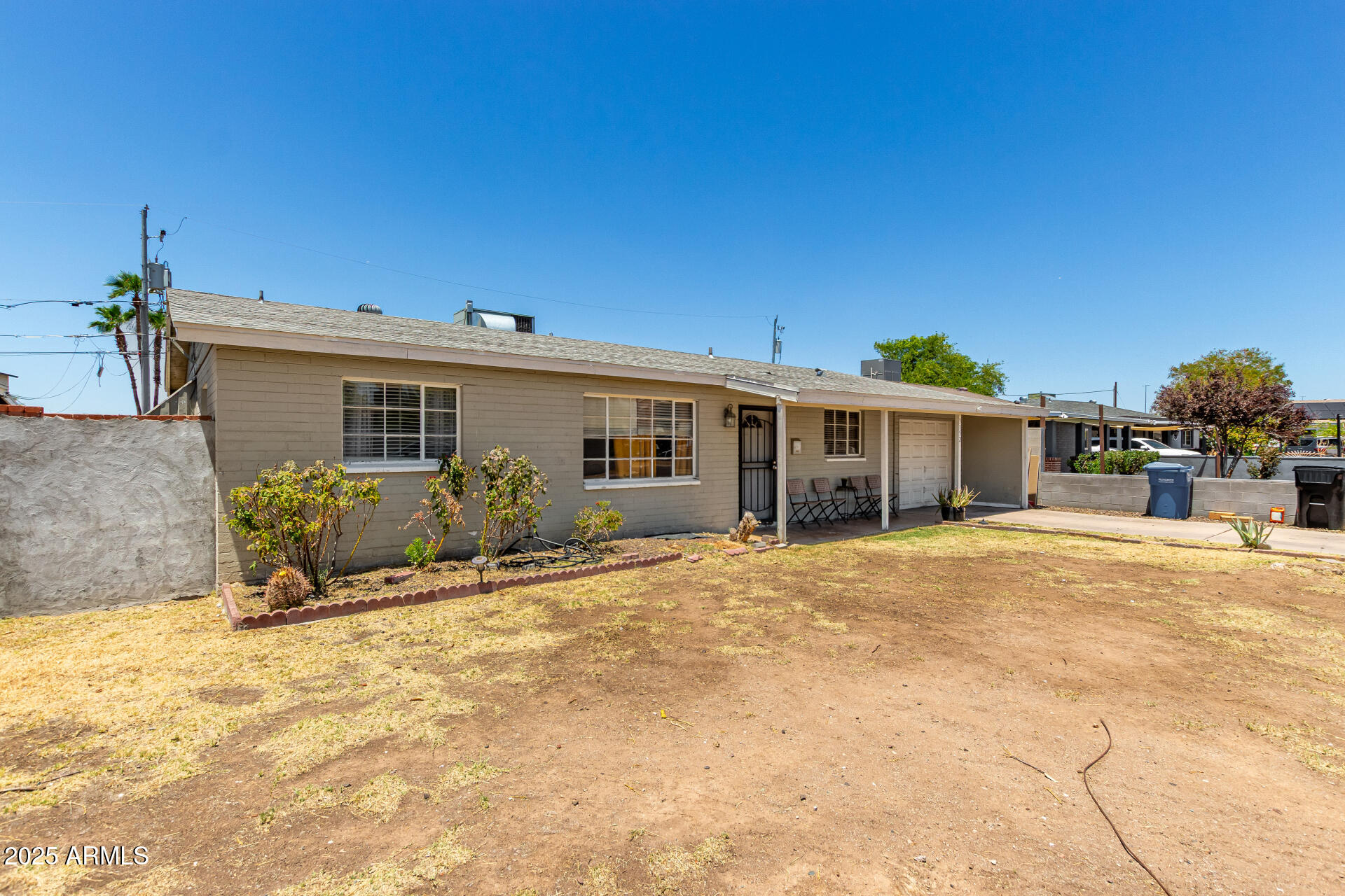 3152 North 24th Drive Phoenix, AZ 85015 - Photo 4 of 28 a front view of a house with a patio