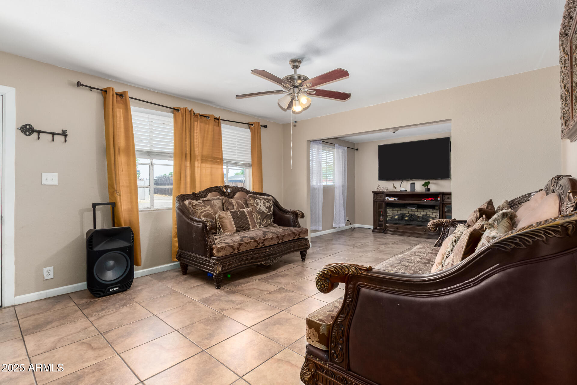 3152 North 24th Drive Phoenix, AZ 85015 - Photo 9 of 28 a living room with furniture and a flat screen tv