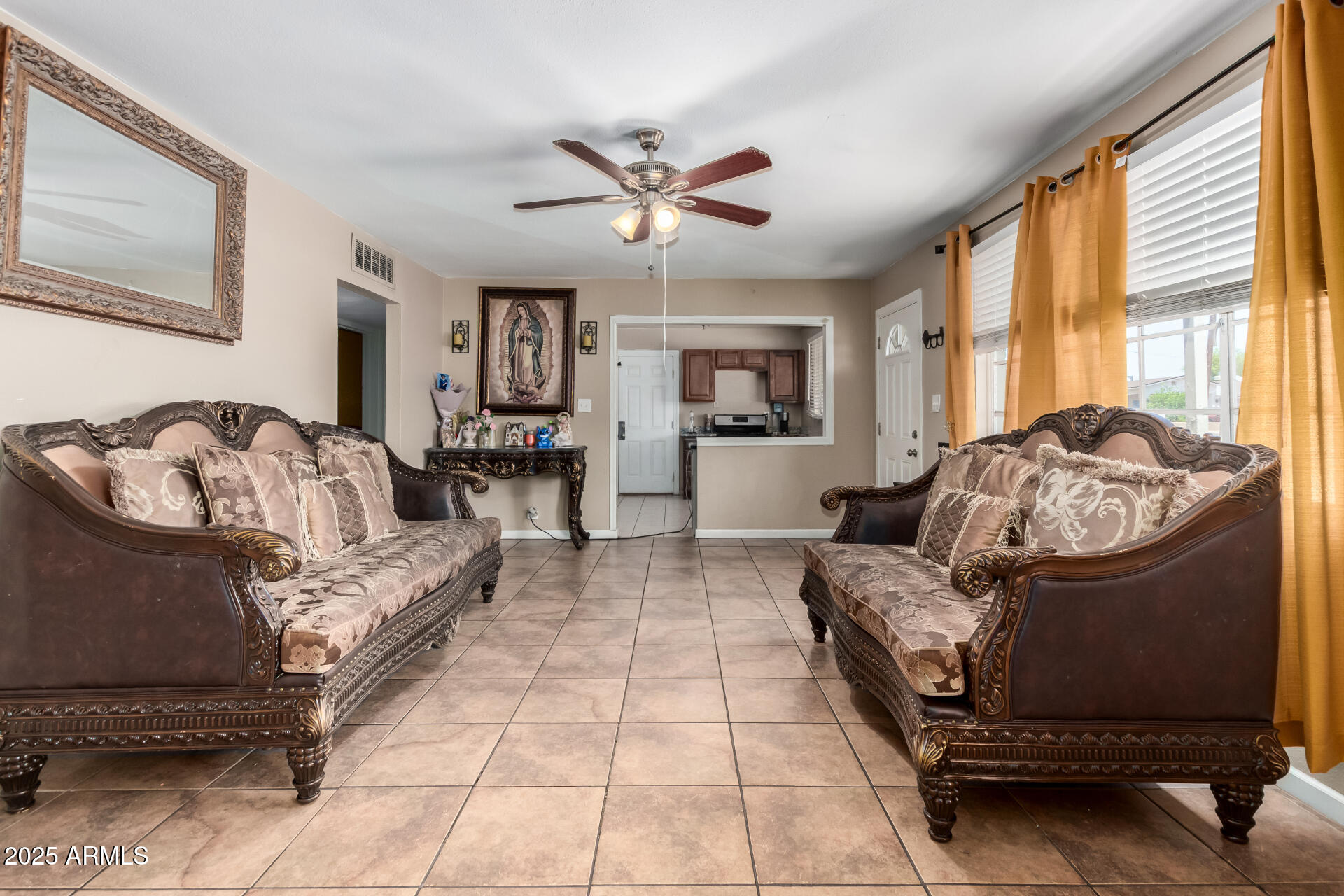 3152 North 24th Drive Phoenix, AZ 85015 - Photo 10 of 28 a living room with furniture and large windows