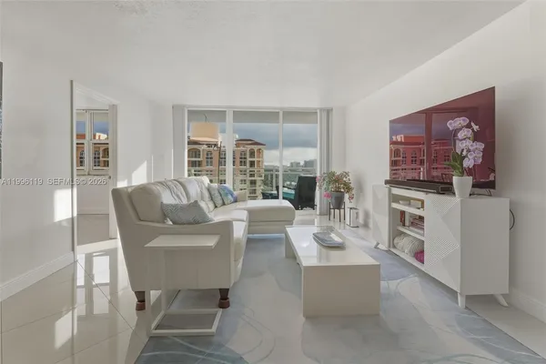 a living room with furniture and a flat screen tv