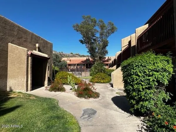 a view of a backyard with sitting area