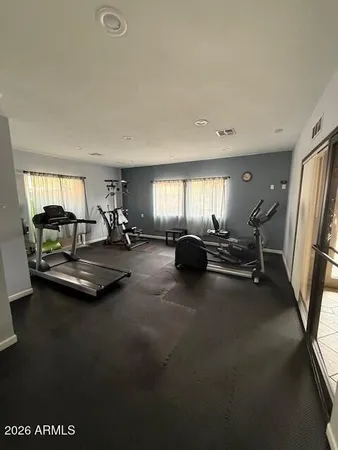 a view of kitchen and hall with wooden floor
