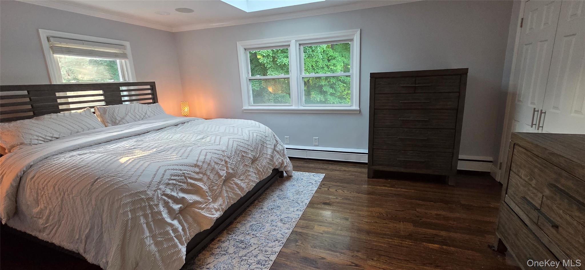 522 Moriches Road St. James, NY 11780 - Photo 31 of 49 a bedroom with a bed and a window
