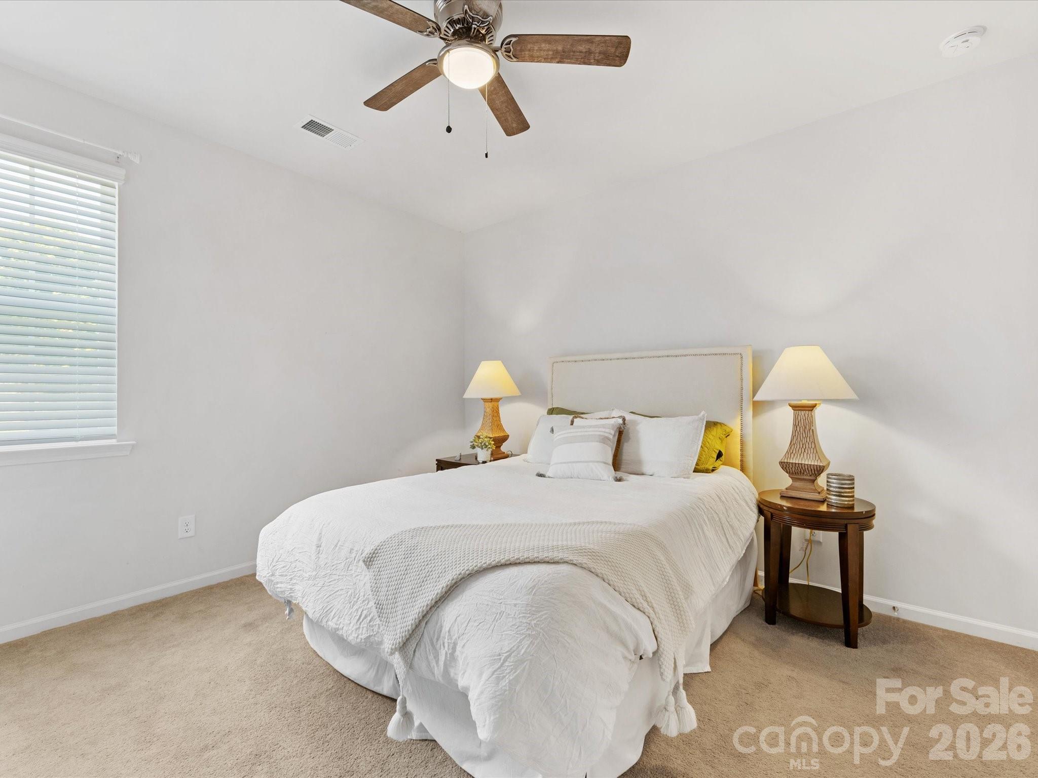 4261 Coachwhip Avenue Lancaster, SC 29720 - Photo 15 of 42 a bedroom with a bed and table