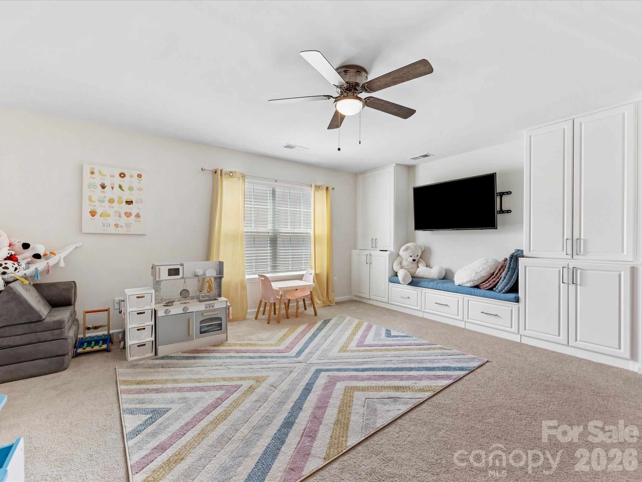 4261 Coachwhip Avenue Lancaster, SC 29720 - Photo 20 of 42 a living room with furniture and a flat screen tv