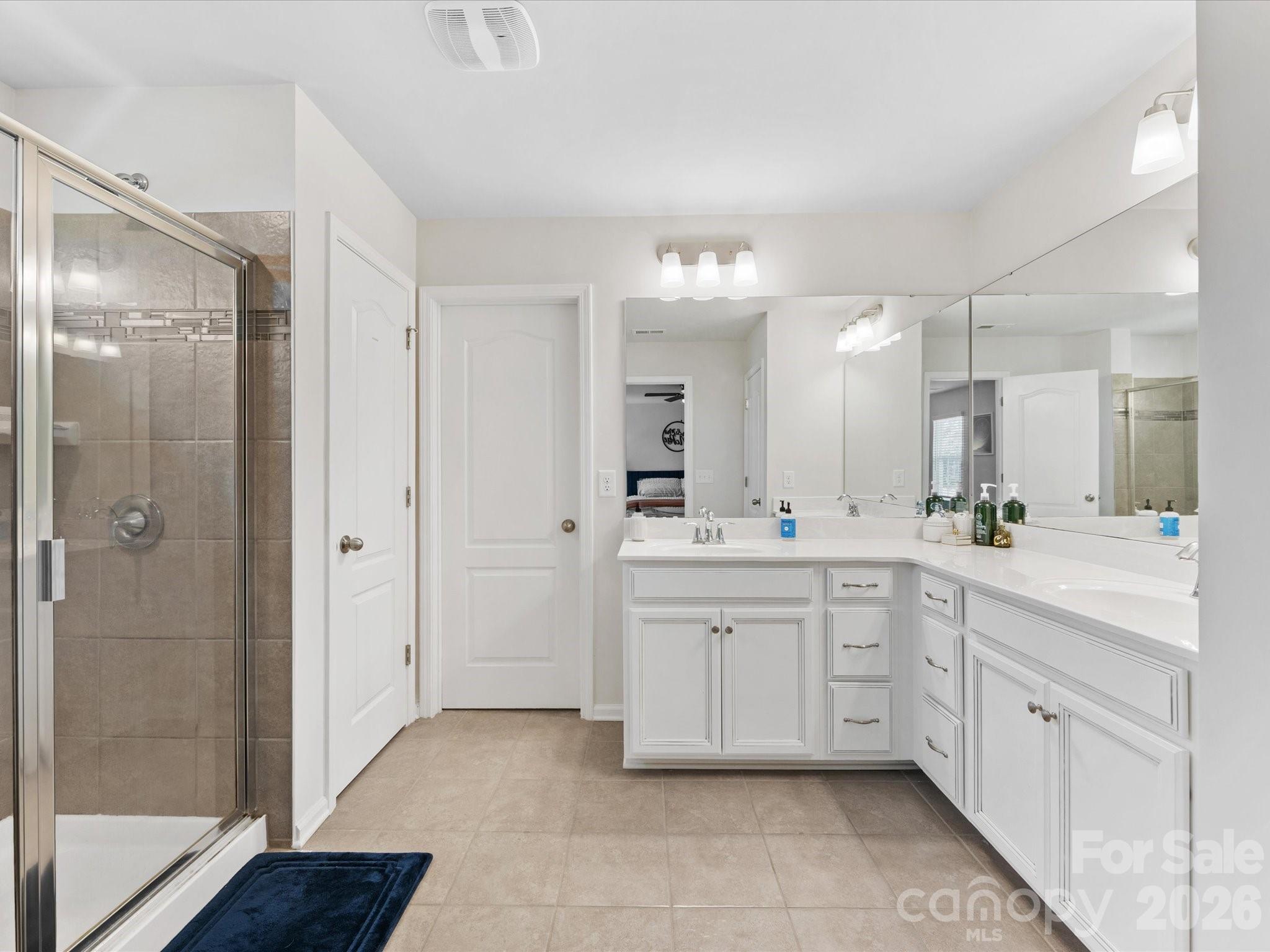 4261 Coachwhip Avenue Lancaster, SC 29720 - Photo 25 of 42 a spacious bathroom with a mirror sink and shower