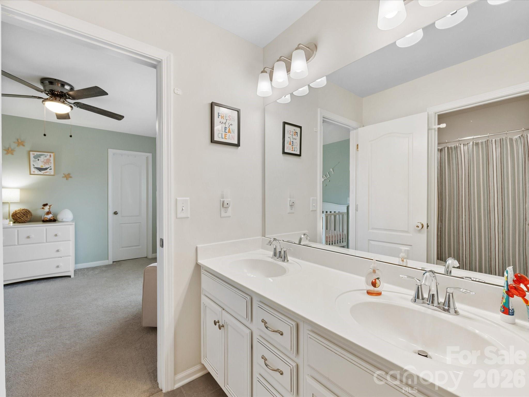 4261 Coachwhip Avenue Lancaster, SC 29720 - Photo 27 of 42 a spacious bathroom with a double vanity sink a mirror and a bathtub