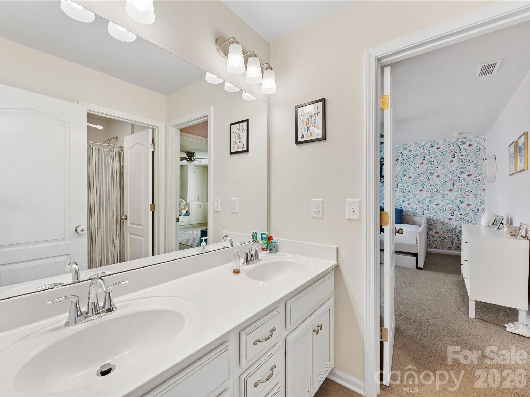 4261 Coachwhip Avenue Lancaster, SC 29720 - Photo 28 of 42 a bathroom with a double vanity sink mirror and