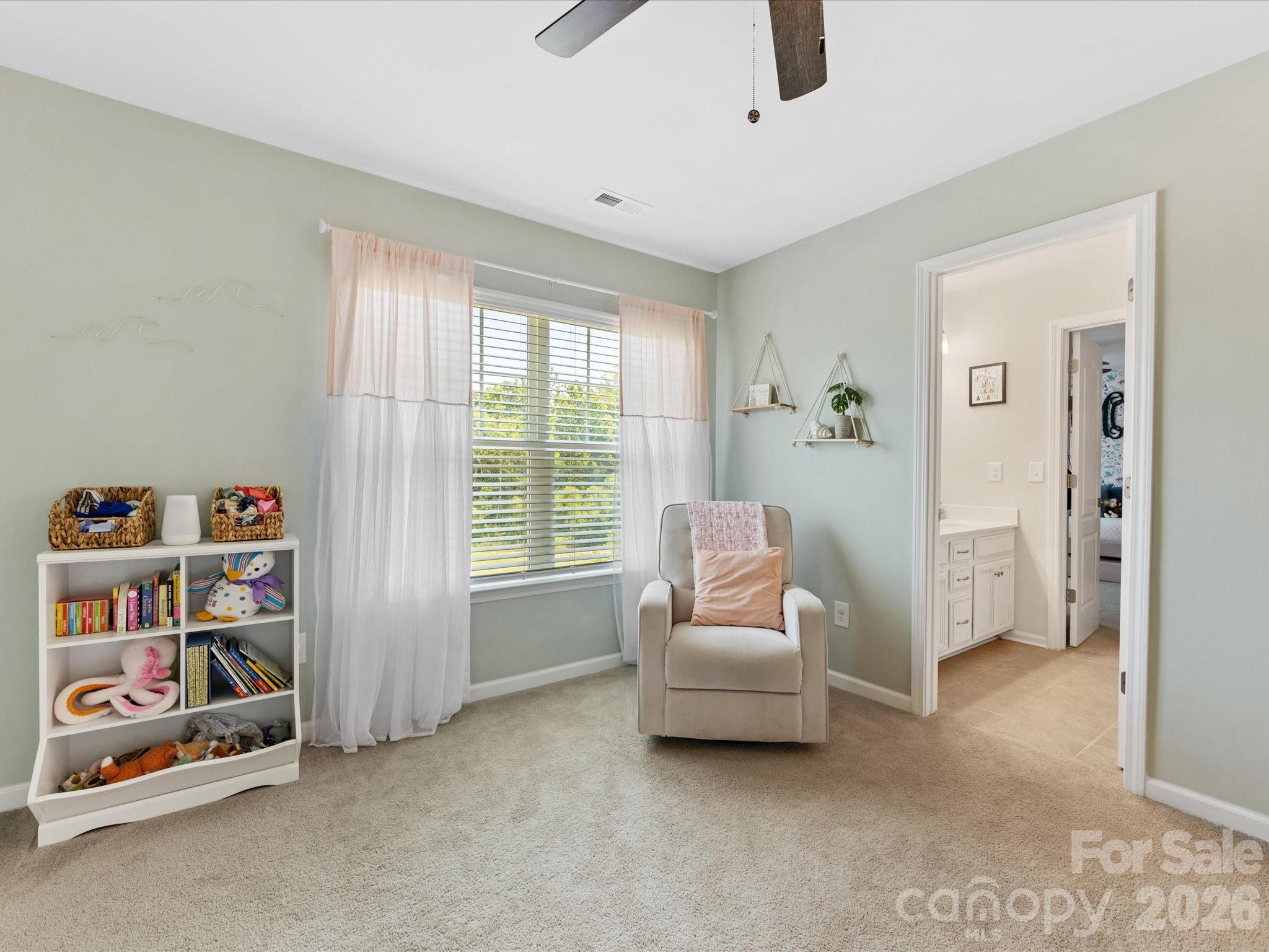 4261 Coachwhip Avenue Lancaster, SC 29720 - Photo 30 of 42 a living room with furniture and a book shelf