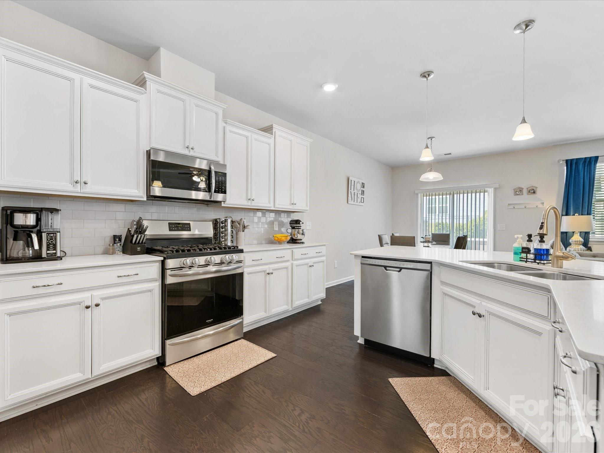 4261 Coachwhip Avenue Lancaster, SC 29720 - Photo 3 of 42 a kitchen with stainless steel appliances granite countertop a sink and cabinets